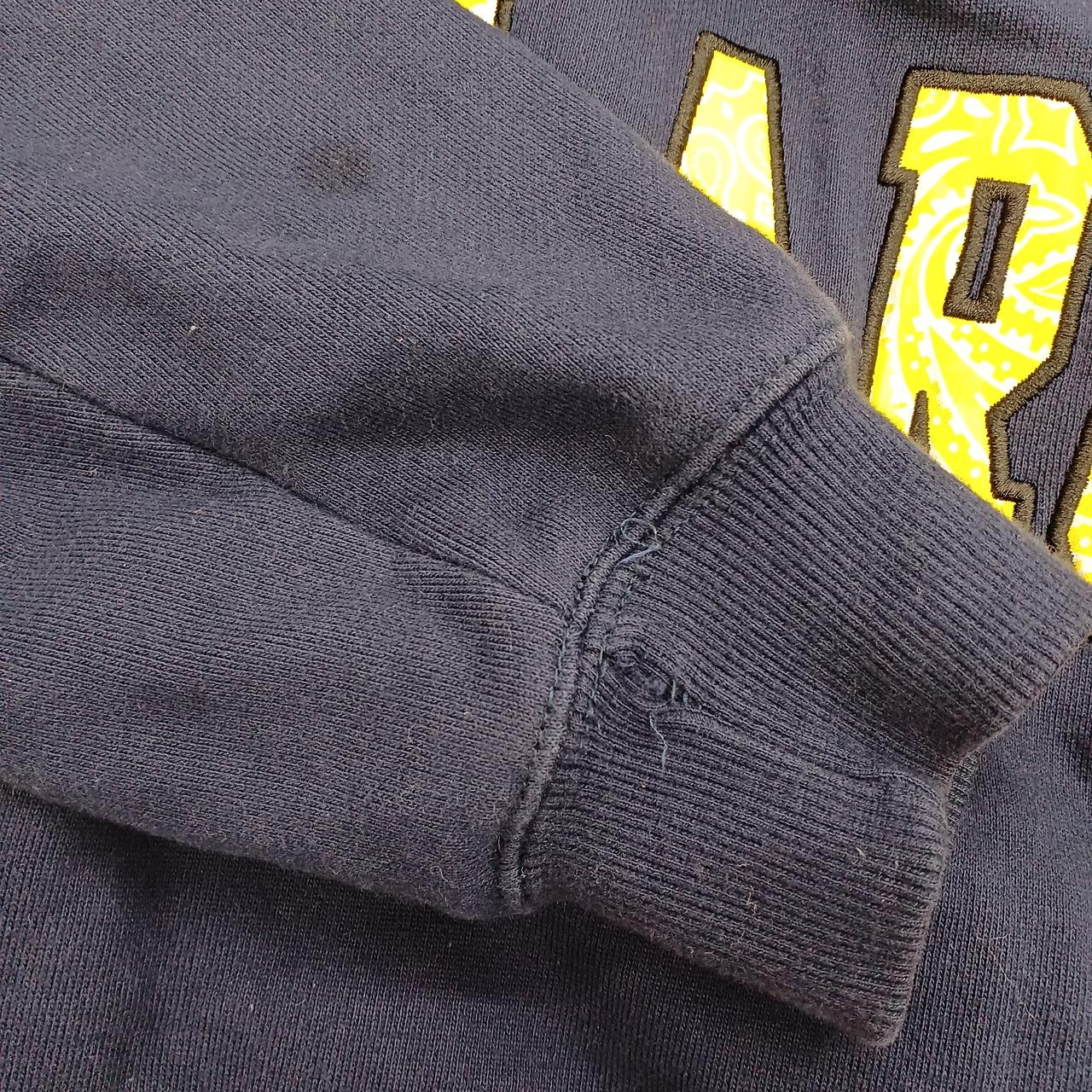 右袖にほつれ、シミあり