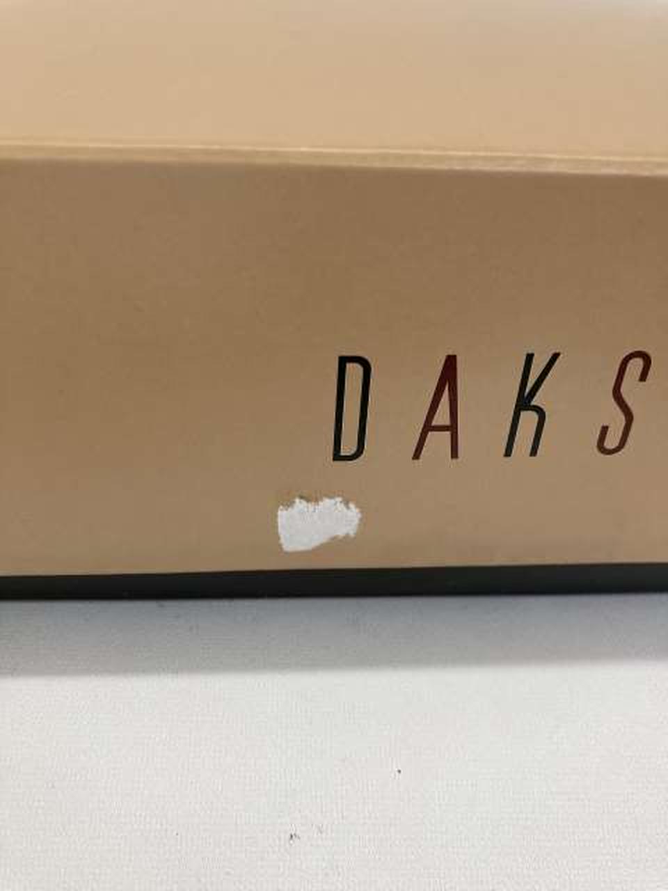 側面テープはがし跡