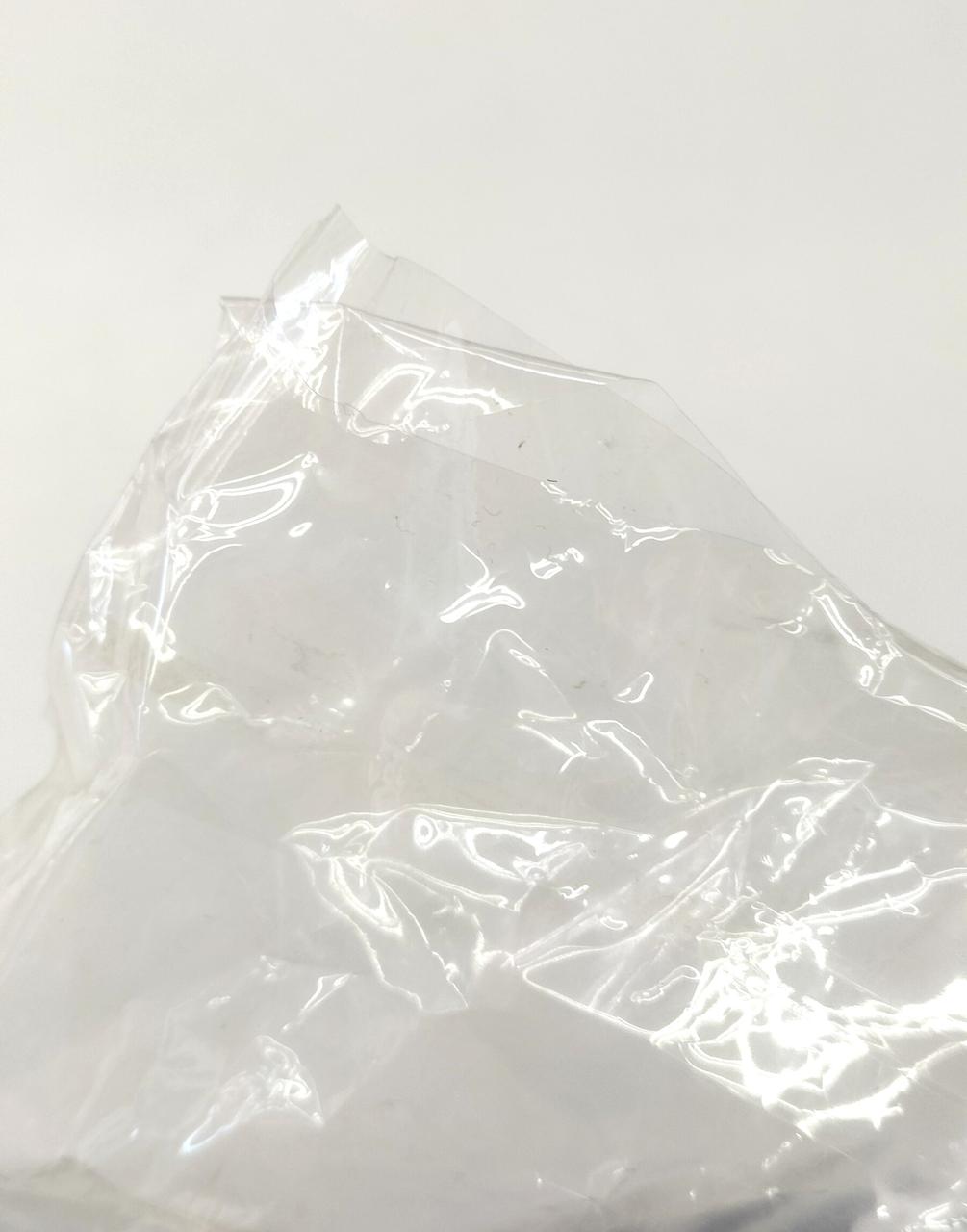 袋下部左端に裂けあり