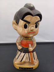 首振り土人形|不明