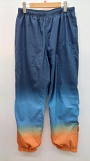 GRADIENT TRACK PANT　NVY×ORN|SUPREME